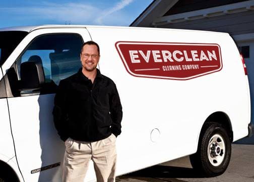 Darrin, owner of Everclean Cleaning Company, standing in front of the Everclean service van